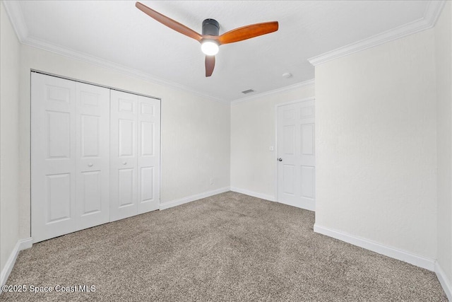 2190 Forest Knoll Dr NE Unit 90-104, Palm Bay, FL 32905 - unfurnished bedroom featuring carpet, a closet, crown molding, and ceiling fan