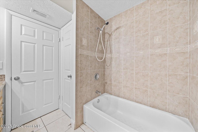 2190 Forest Knoll Dr NE Unit 90-104, Palm Bay, FL 32905 - full bath featuring tile patterned floors, a textured ceiling, and bathtub / shower combination