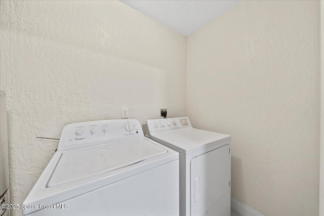 2190 Forest Knoll Dr NE Unit 90-104, Palm Bay, FL 32905 - washroom featuring washer and dryer and a textured wall
