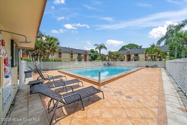 2190 Forest Knoll Dr NE Unit 90-104, Palm Bay, FL 32905 - community pool with a patio area and a residential view