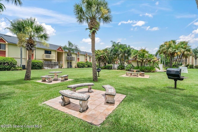2190 Forest Knoll Dr NE Unit 90-104, Palm Bay, FL 32905 - view of community featuring a yard and a residential view