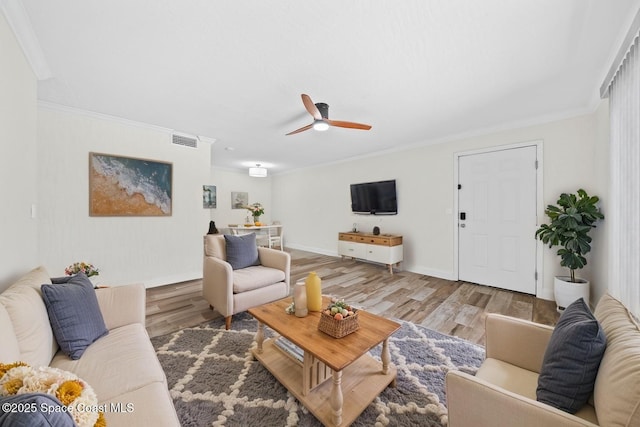 2190 Forest Knoll Dr NE Unit 90-104, Palm Bay, FL 32905 - living area with light wood finished floors, ceiling fan, and crown molding