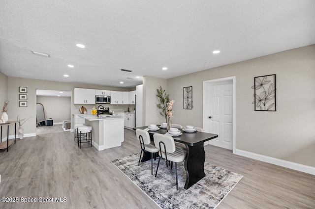 532 Buckingham Ave, Melbourne, FL 32935 - dining area with light wood-type flooring and recessed lighting