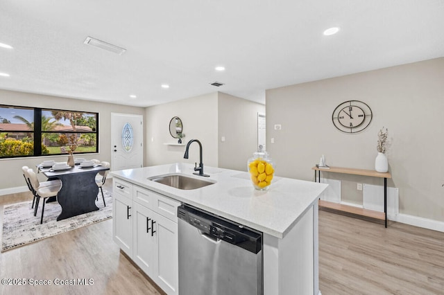 532 Buckingham Ave, Melbourne, FL 32935 - kitchen featuring dishwasher, light wood-style flooring, an island with sink, white cabinets, and recessed lighting