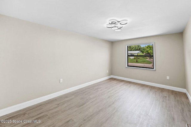 532 Buckingham Ave, Melbourne, FL 32935 - spare room featuring wood finished floors and baseboards