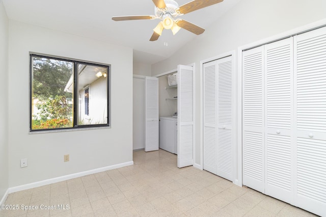 1570 Frontier Dr, Melbourne, FL 32940 - unfurnished bedroom featuring washer / clothes dryer, multiple closets, tile patterned floors, vaulted ceiling, and a ceiling fan