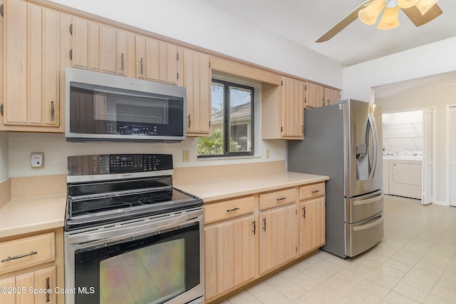 1570 Frontier Dr, Melbourne, FL 32940 - kitchen with stainless steel appliances, light brown cabinets, washing machine and clothes dryer, and light countertops