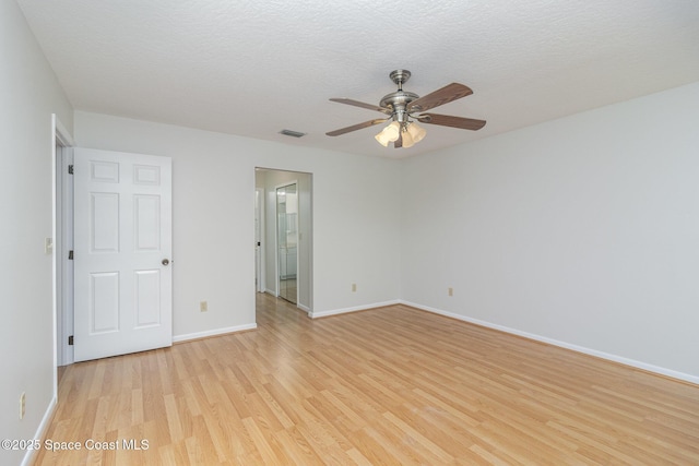 1570 Frontier Dr, Melbourne, FL 32940 - spare room with light wood-style floors, a ceiling fan, and a textured ceiling