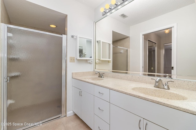 1570 Frontier Dr, Melbourne, FL 32940 - bathroom featuring double vanity and a shower stall