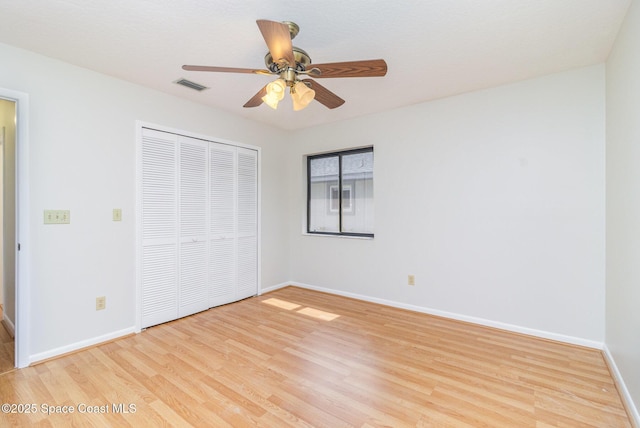 1570 Frontier Dr, Melbourne, FL 32940 - unfurnished bedroom featuring light wood-style flooring, a closet, and ceiling fan