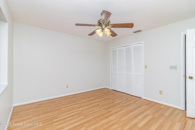 1570 Frontier Dr, Melbourne, FL 32940 - unfurnished bedroom with wood finished floors, a closet, and ceiling fan