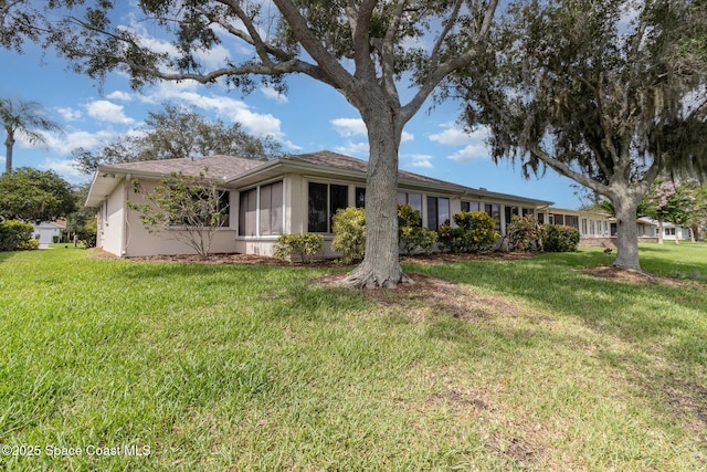 1570 Frontier Dr, Melbourne, FL 32940 - single story home featuring a sunroom and a front yard