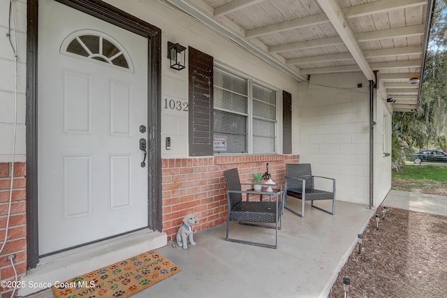 1032 Bernice Rd, Rockledge, FL 32955 - view of exterior entry with covered porch and concrete block siding