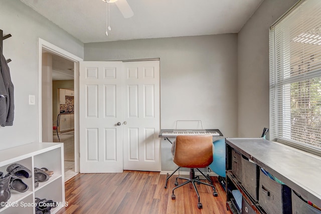 1032 Bernice Rd, Rockledge, FL 32955 - home office featuring wood finished floors and a ceiling fan