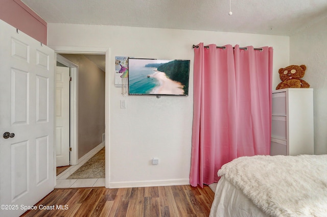 1032 Bernice Rd, Rockledge, FL 32955 - bedroom with wood finished floors and baseboards