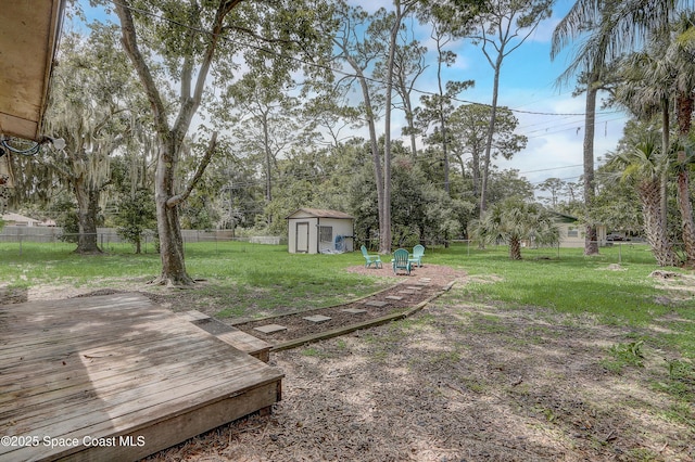 1032 Bernice Rd, Rockledge, FL 32955 - fenced backyard with a storage shed and a deck