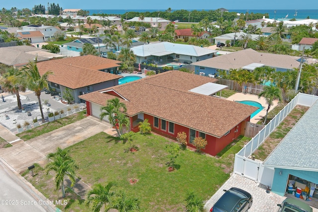 765 Palm Dr, Satellite Beach, FL 32937 - aerial perspective of suburban area featuring a pool and a nearby body of water