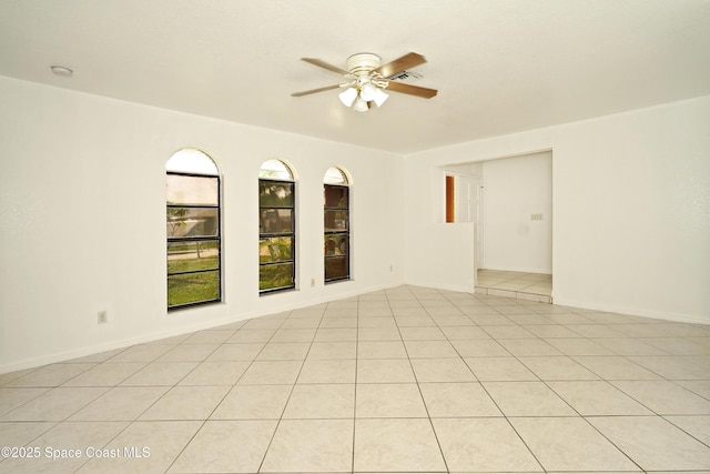 765 Palm Dr, Satellite Beach, FL 32937 - unfurnished room featuring a ceiling fan, light tile patterned floors, and a smoke detector