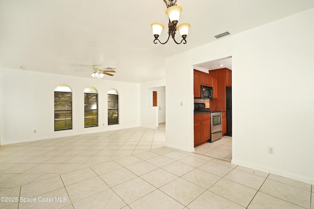 765 Palm Dr, Satellite Beach, FL 32937 - empty room featuring light tile patterned floors, a chandelier, and ceiling fan