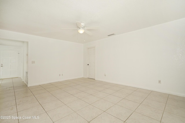 765 Palm Dr, Satellite Beach, FL 32937 - empty room featuring a ceiling fan and light tile patterned flooring