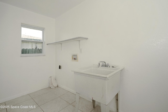 765 Palm Dr, Satellite Beach, FL 32937 - laundry area with washer hookup and light tile patterned floors