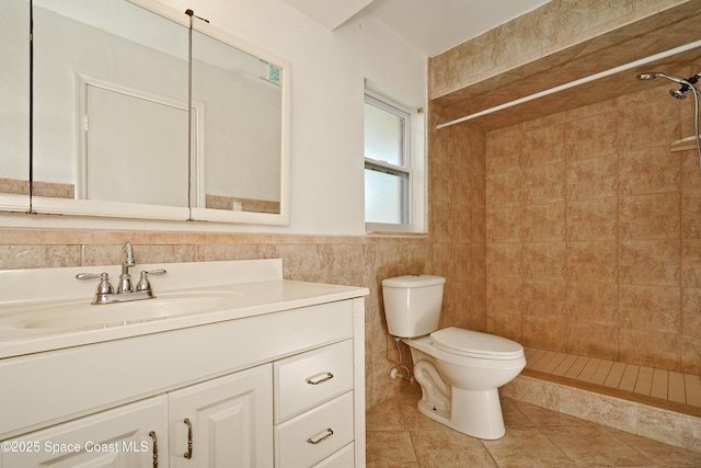 765 Palm Dr, Satellite Beach, FL 32937 - bathroom featuring vanity, a tile shower, tile walls, and tile patterned floors