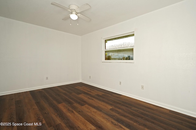 765 Palm Dr, Satellite Beach, FL 32937 - empty room featuring dark wood-style flooring and a ceiling fan