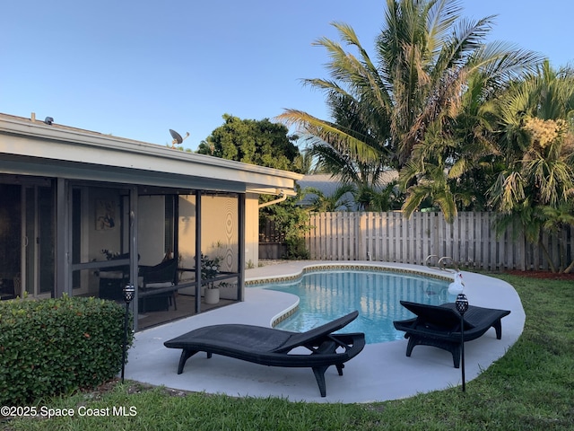 658 Hibiscus Dr, Satellite Beach, FL 32937 - view of pool with a fenced backyard, a patio area, and a sunroom