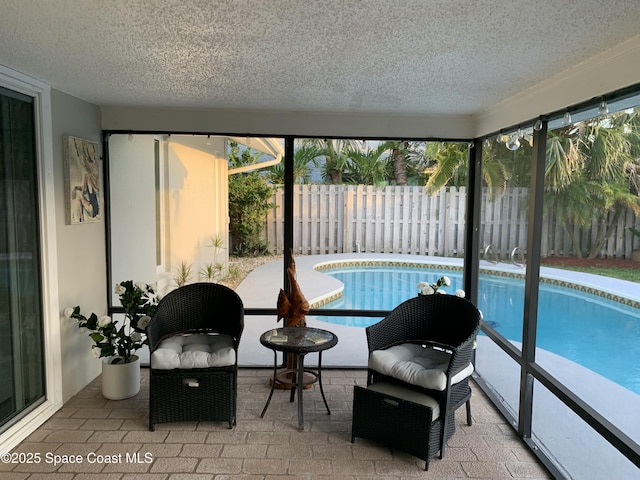 658 Hibiscus Dr, Satellite Beach, FL 32937 - sunroom with a textured ceiling and healthy amount of natural light