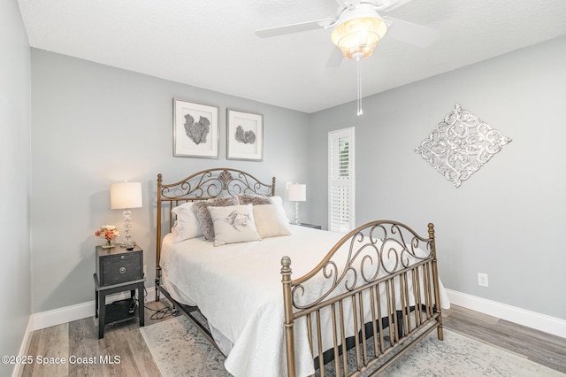 658 Hibiscus Dr, Satellite Beach, FL 32937 - bedroom featuring wood finished floors and ceiling fan