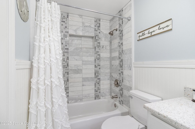 658 Hibiscus Dr, Satellite Beach, FL 32937 - bathroom featuring wainscoting, shower / bath combination with curtain, vanity, and a decorative wall