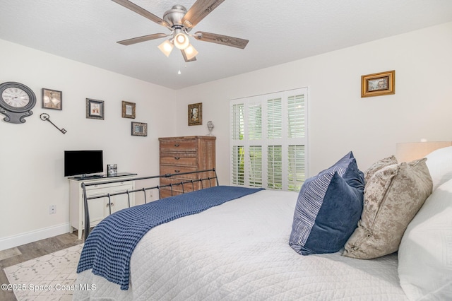 658 Hibiscus Dr, Satellite Beach, FL 32937 - bedroom featuring wood finished floors and a ceiling fan