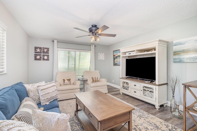 658 Hibiscus Dr, Satellite Beach, FL 32937 - living area with wood finished floors, ceiling fan, and a textured ceiling