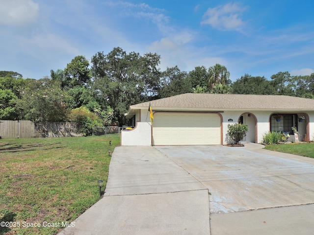 1368 Gleneagles Way, Rockledge, FL 32955 - view of front facade with driveway, a garage, and view of scattered trees