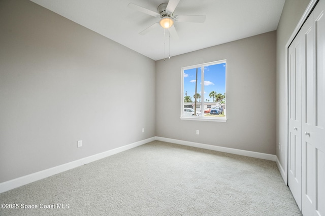 1107 Conquistador Dr, Rockledge, FL 32955 - unfurnished bedroom featuring a closet, light carpet, and a ceiling fan