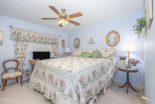 1005 Knox Mcrae Dr Unit B-210, Titusville, FL 32780 - carpeted bedroom featuring baseboards and ceiling fan