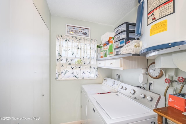1005 Knox Mcrae Dr Unit B-210, Titusville, FL 32780 - laundry area featuring separate washer and dryer
