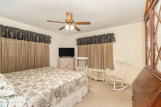 1005 Knox Mcrae Dr Unit B-210, Titusville, FL 32780 - bedroom with light carpet and ceiling fan