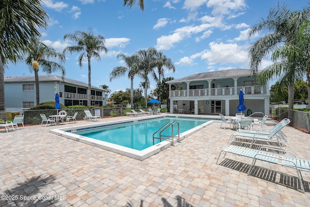 1005 Knox Mcrae Dr Unit B-210, Titusville, FL 32780 - community pool featuring a patio area