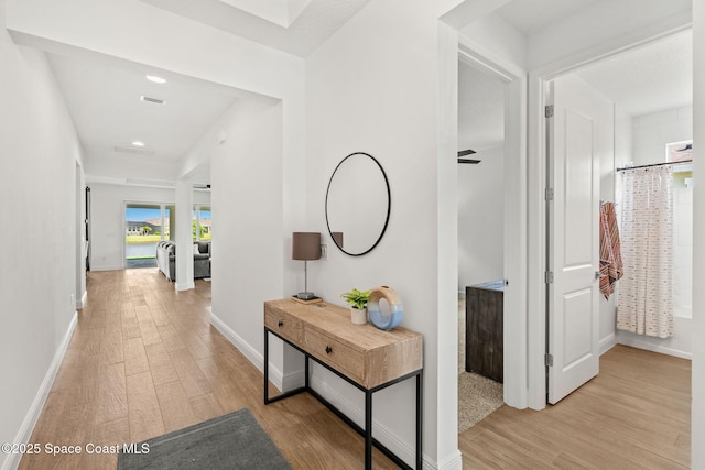 9374 Corvo Ct, Melbourne, FL 32940 - hallway with light wood finished floors and recessed lighting