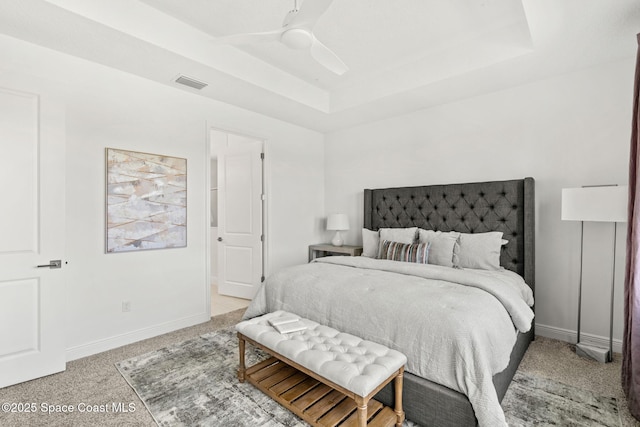 9374 Corvo Ct, Melbourne, FL 32940 - bedroom with a raised ceiling, light carpet, and a ceiling fan