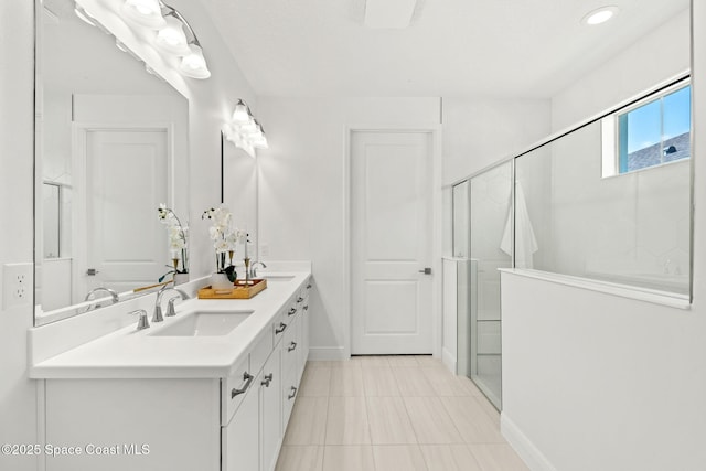 9374 Corvo Ct, Melbourne, FL 32940 - full bath with double vanity, a shower stall, tile patterned floors, and recessed lighting