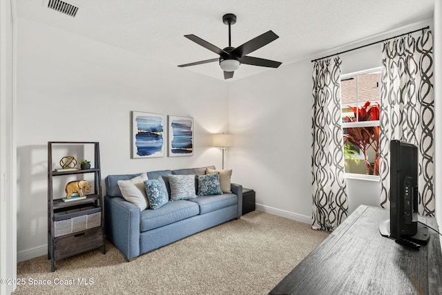 9374 Corvo Ct, Melbourne, FL 32940 - carpeted living room with ceiling fan and baseboards
