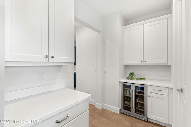 9374 Corvo Ct, Melbourne, FL 32940 - indoor dry bar featuring wine cooler and light wood finished floors