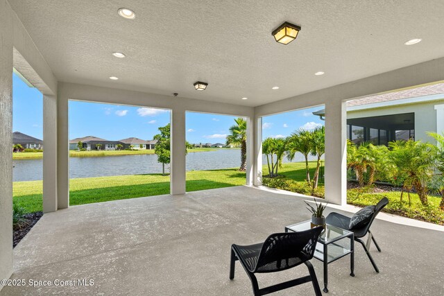 9374 Corvo Ct, Melbourne, FL 32940 - view of patio / terrace featuring a water view