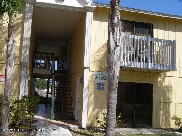 2101 Forest Knoll Dr NE Unit 01-101, Palm Bay, FL 32905 - property entrance featuring a balcony