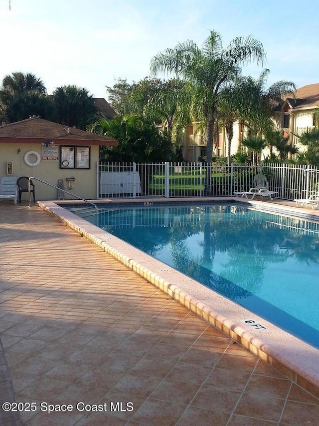 2101 Forest Knoll Dr NE Unit 01-101, Palm Bay, FL 32905 - community pool featuring a patio area