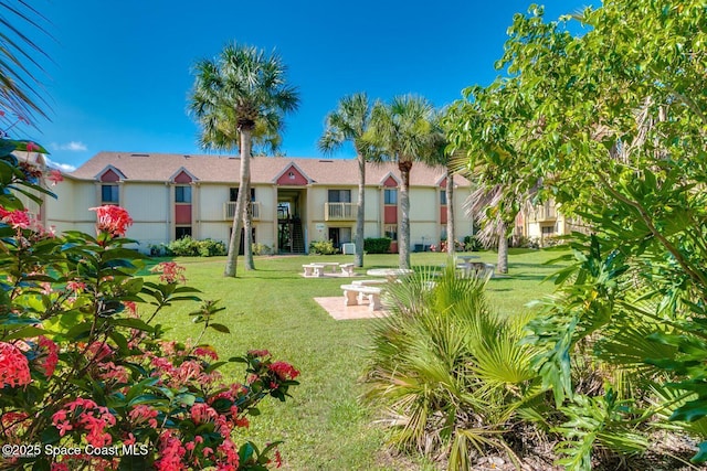 2101 Forest Knoll Dr NE Unit 01-101, Palm Bay, FL 32905 - view of green lawn