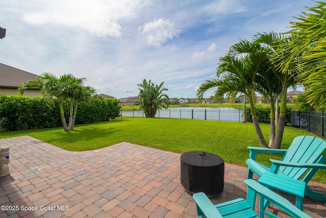 739 Fiddleleaf Cir, Melbourne, FL 32904 - fenced backyard with a water view and a patio