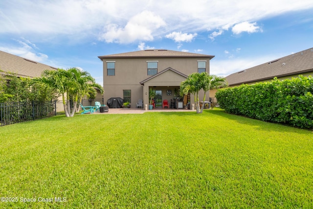 739 Fiddleleaf Cir, Melbourne, FL 32904 - back of property with stucco siding and a patio area